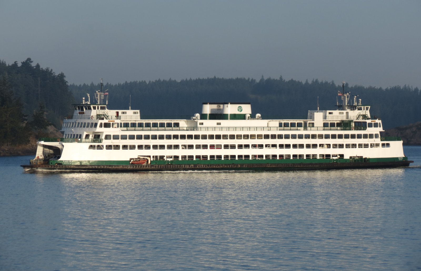 Anacortes Ferry Terminal with Washington State Ferry loading, cars in lanes, and San Juan Islands visible in distance