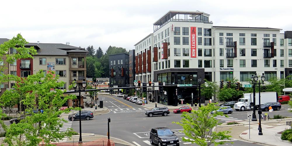Downtown Bothell Main Street with historic buildings, McMenamins Anderson School, and modern biotech buildings