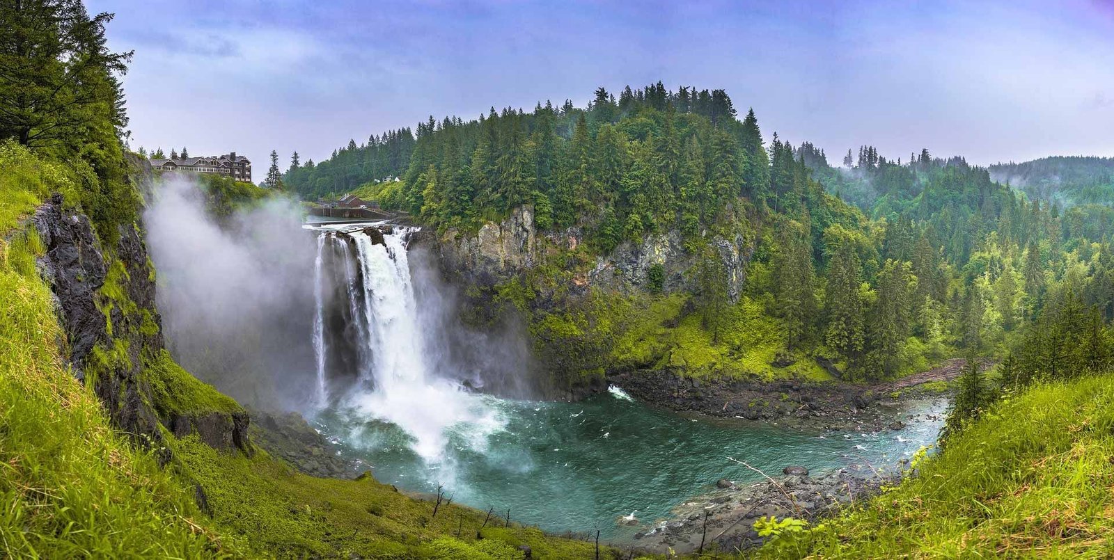 Snoqualmie Falls with viewing platform and mist rising from the powerful cascade