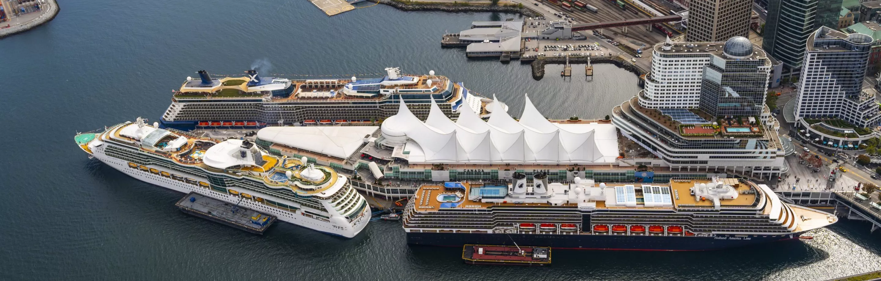 Canada Place cruise terminal with cruise ship docked and Vancouver Convention Centre